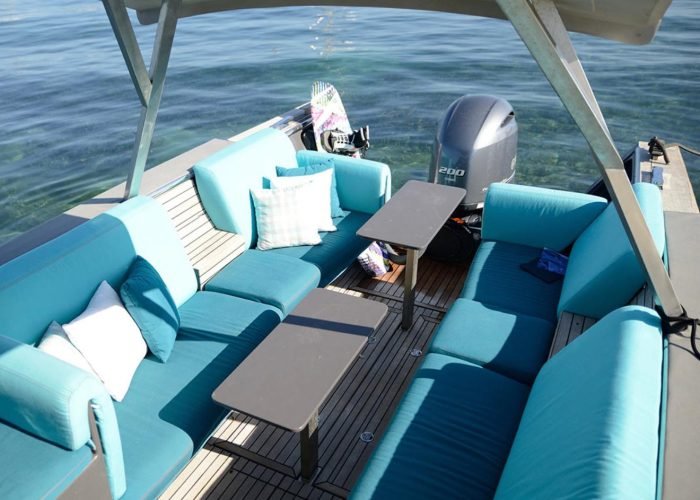 Custom boat cushions on a luxury motorboat deck